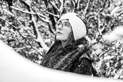 Portrait of smiling young woman in snow