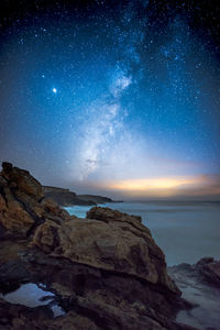 Scenic view of sea against sky at night