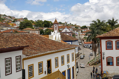 Buildings in town against sky