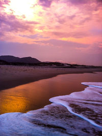 Scenic view of sea at sunset