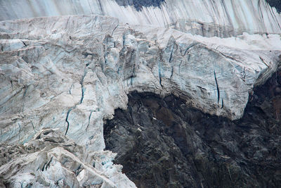 Ice with cracks, glacier on a rock close-up, akkem glacier in altai