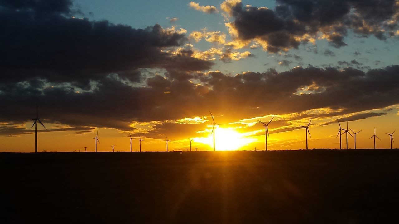 SCENIC VIEW OF SILHOUETTE FIELD AGAINST SKY AT SUNSET