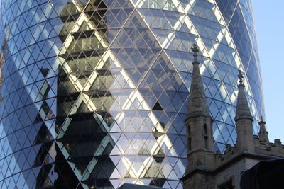 Low angle view of built structure against blue sky