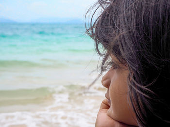 Close-up portrait of woman on beach