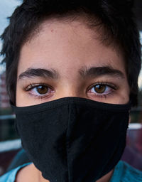 Brazilian boy using mask during the quarantine.
