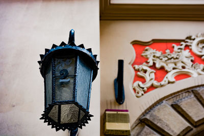 Low angle view of decoration hanging on building