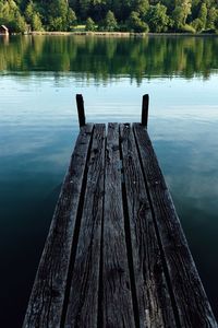 Wooden pier over lake in forest