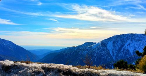 Scenic view of mountains against sky during winter