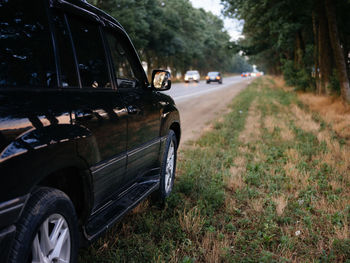 View of abandoned car on road
