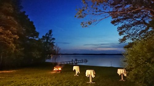 Scenic view of beach against sky at night