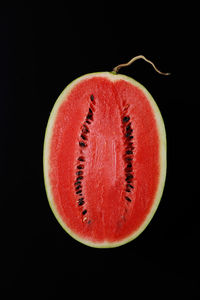 Close-up of strawberry over black background