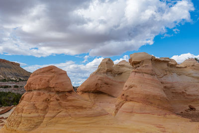 Landscape of large yellow striped conical rock formations at ojito wilderness in new mexico