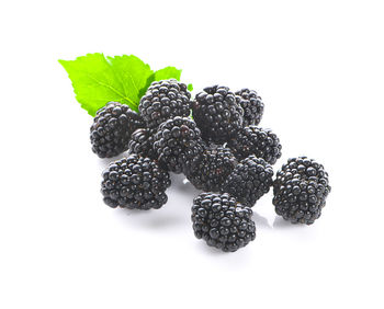 Close-up of fruits against white background