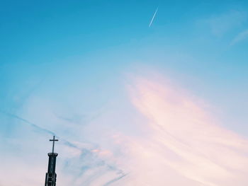 Low angle view of cross against sky at sunset