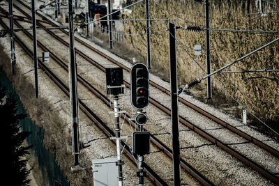 High angle view of railway signal by railroad tracks