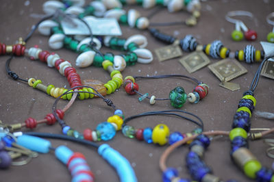 Close-up of multi colored beads on table