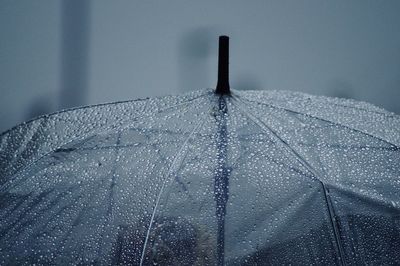 Close-up of wet umbrella outdoors