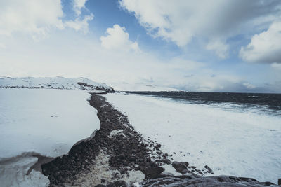 Scenic view of sea against sky during winter