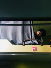 Boy lying down in train