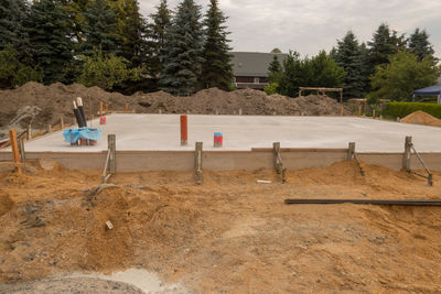 Construction site on field against sky