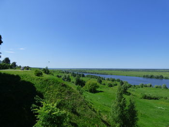 Scenic view of landscape against clear blue sky