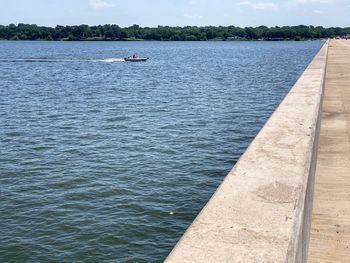 Sailboat on sea against sky
