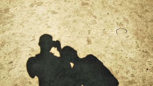 Shadow of people on sand