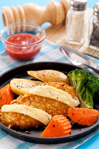 Close-up of food served on table