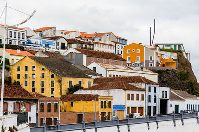 Buildings in city against sky