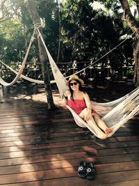 Woman relaxing on hammock