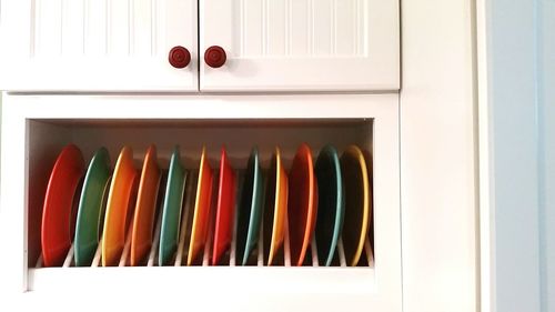 Close-up of colorful plates in kitchen