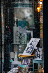 Text on glass window in city