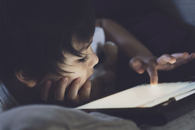 Close-up of boy using tablet