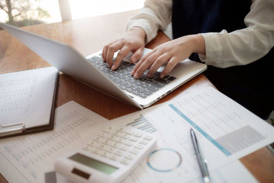 High angle view of man using laptop on table