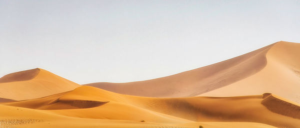 Scenic view of desert against clear sky