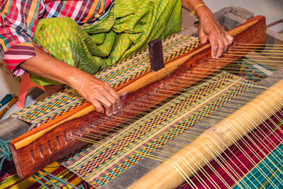 Midsection of woman working in textile industry