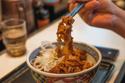 Close-up of person holding food