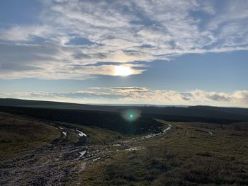 Scenic view of landscape against sky during sunset
