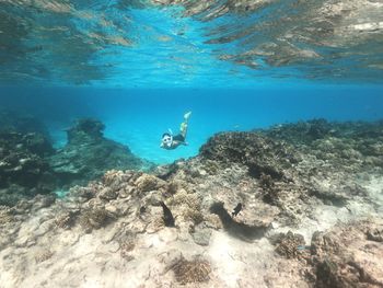 Woman swimming in sea