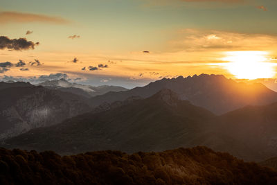 Scenic view of mountains against sky during sunset