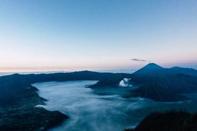 Scenic view of volcanic crater against sky during sunset