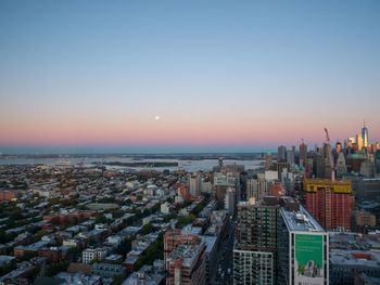 High angle view of buildings against sky during sunset