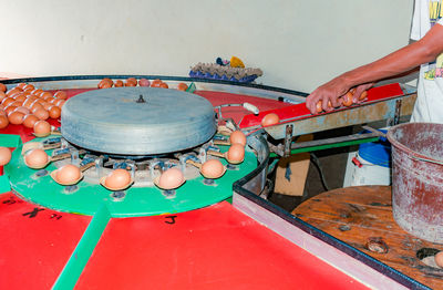 Cropped hand of man working at table