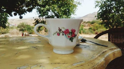 Close-up of coffee cup on table