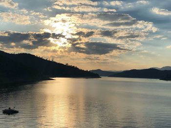 Scenic view of lake against sky during sunset