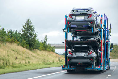 Cars on road against sky