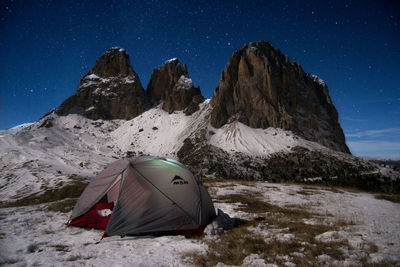 Scenic view of mountains against sky at night