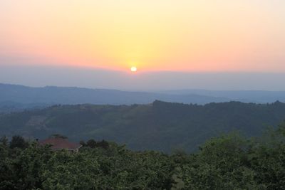 Scenic view of landscape against sky during sunset