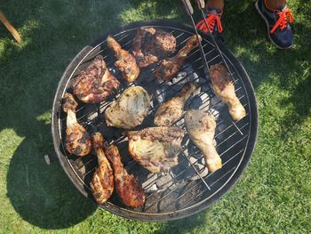 High angle view of meat on barbecue grill