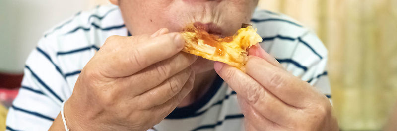 Close-up of man eating food